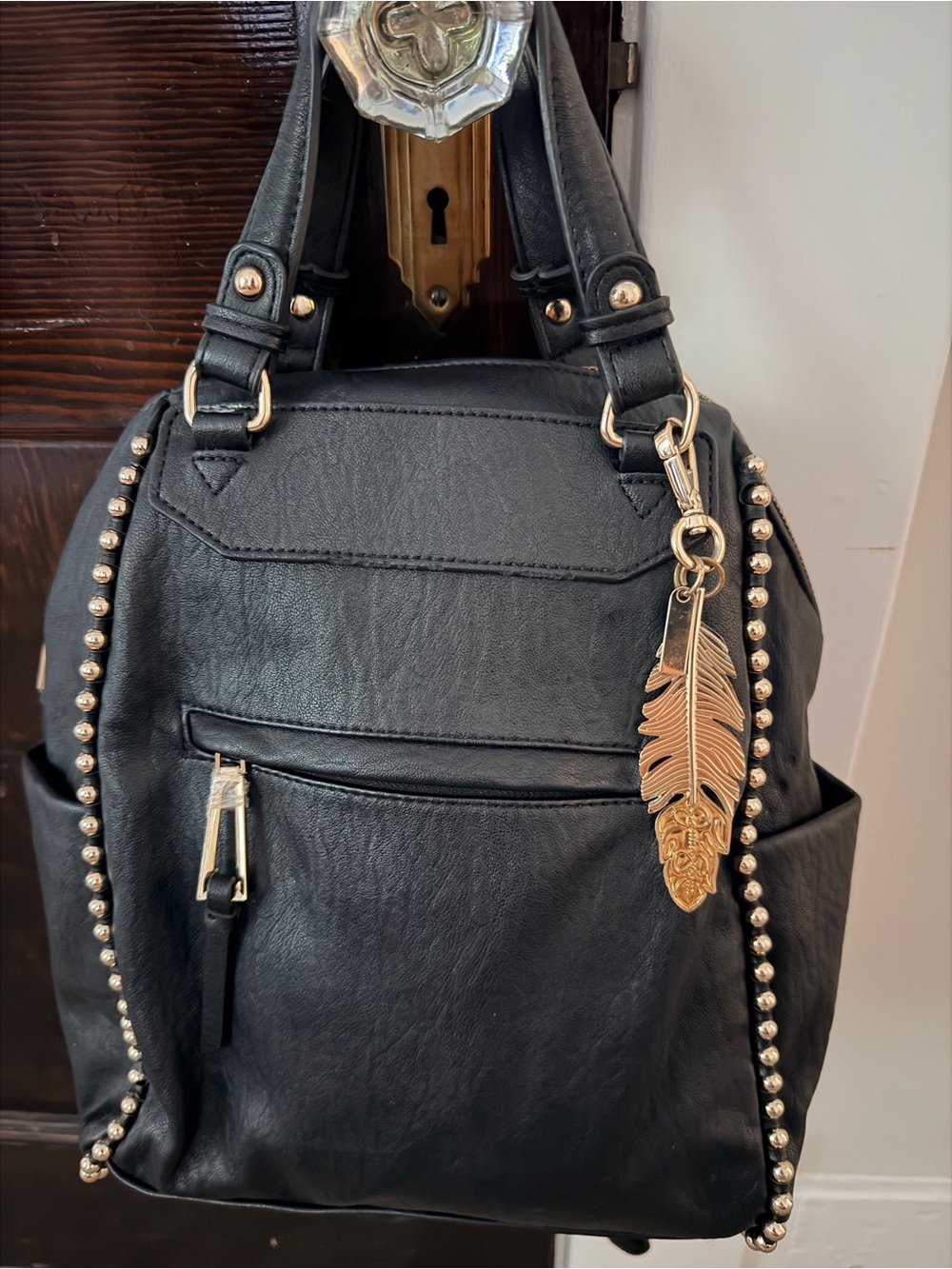 Jessica Simpson Black Women’s Stud-Trim Backpack with Gold Feather Charm